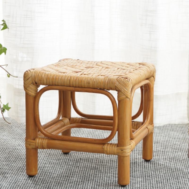 Light wood footstool with a hand-braided rattan top