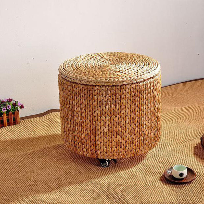 Rattan storage ottoman on casters with a lid – shown in a room setting