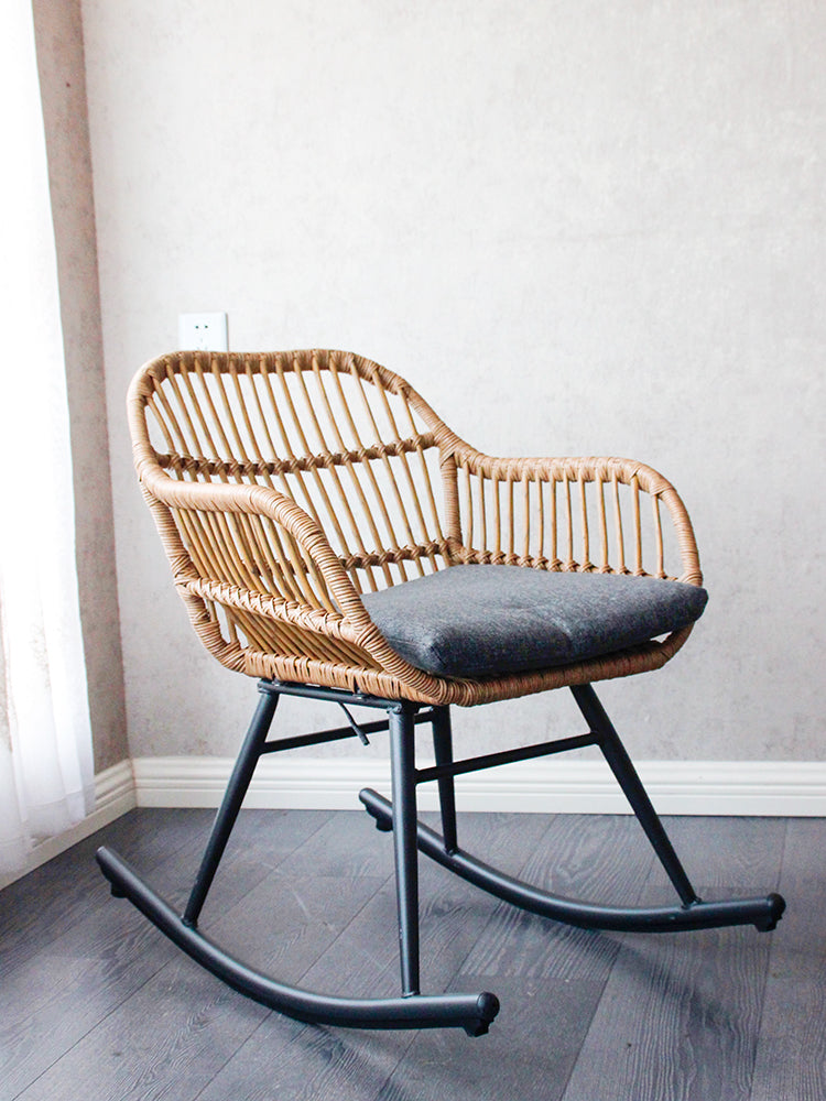 Light honey rattan rocking chair with soft curves – shown in a room setting