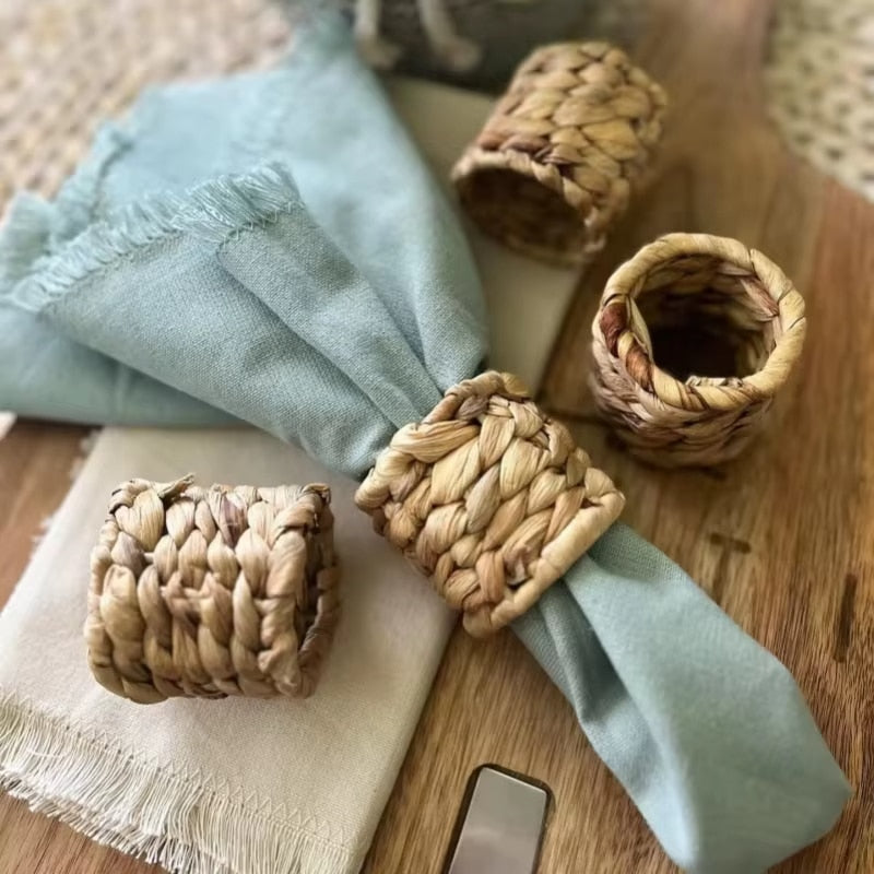 Braided golden raw rattan napkin ring – shown in a room setting