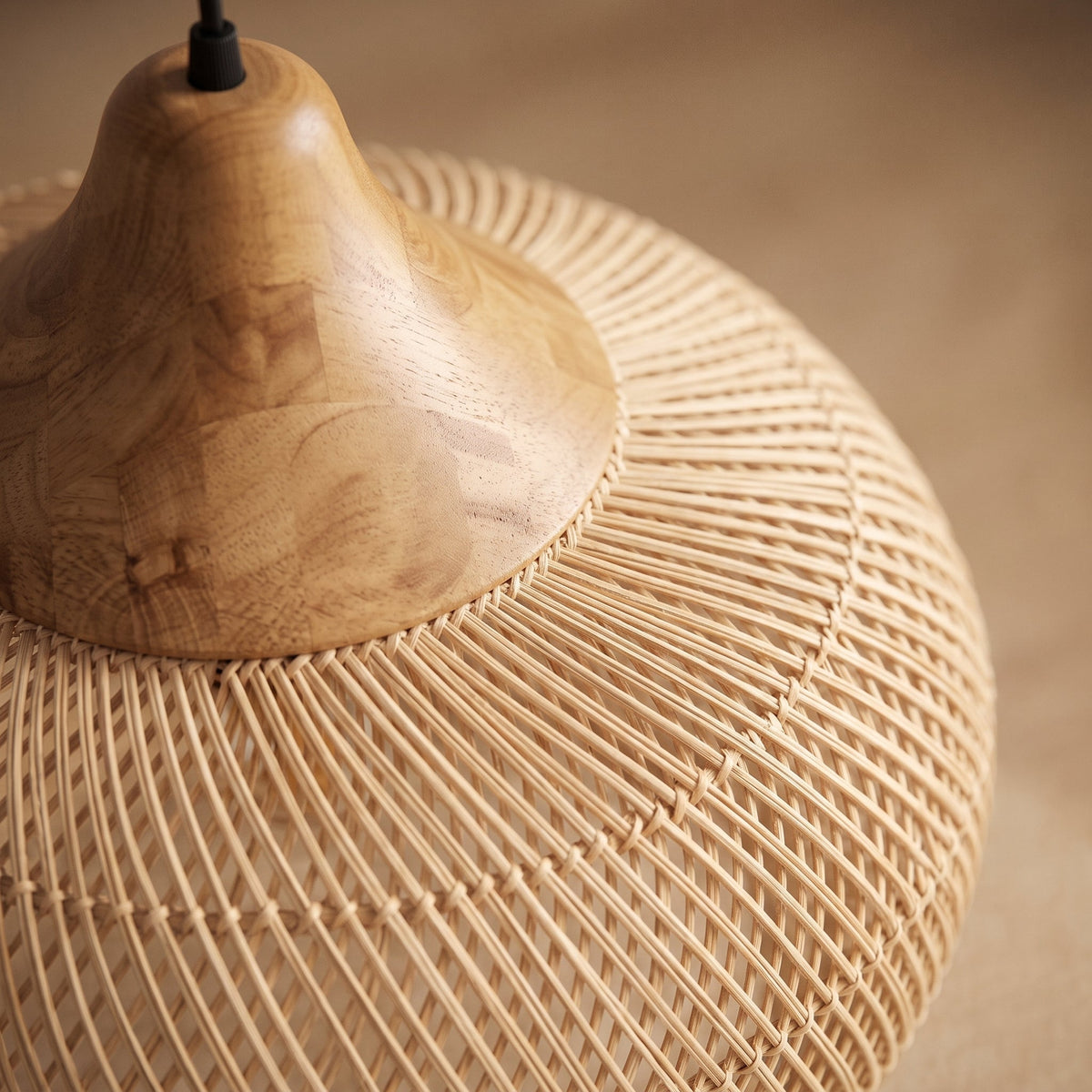 Rounded rattan pendant light with wood cap – close-up detail