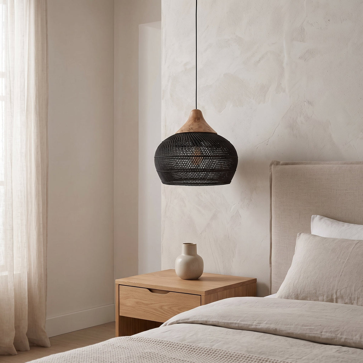 Black rattan pendant light with natural wood cap – shown in a room setting (4)