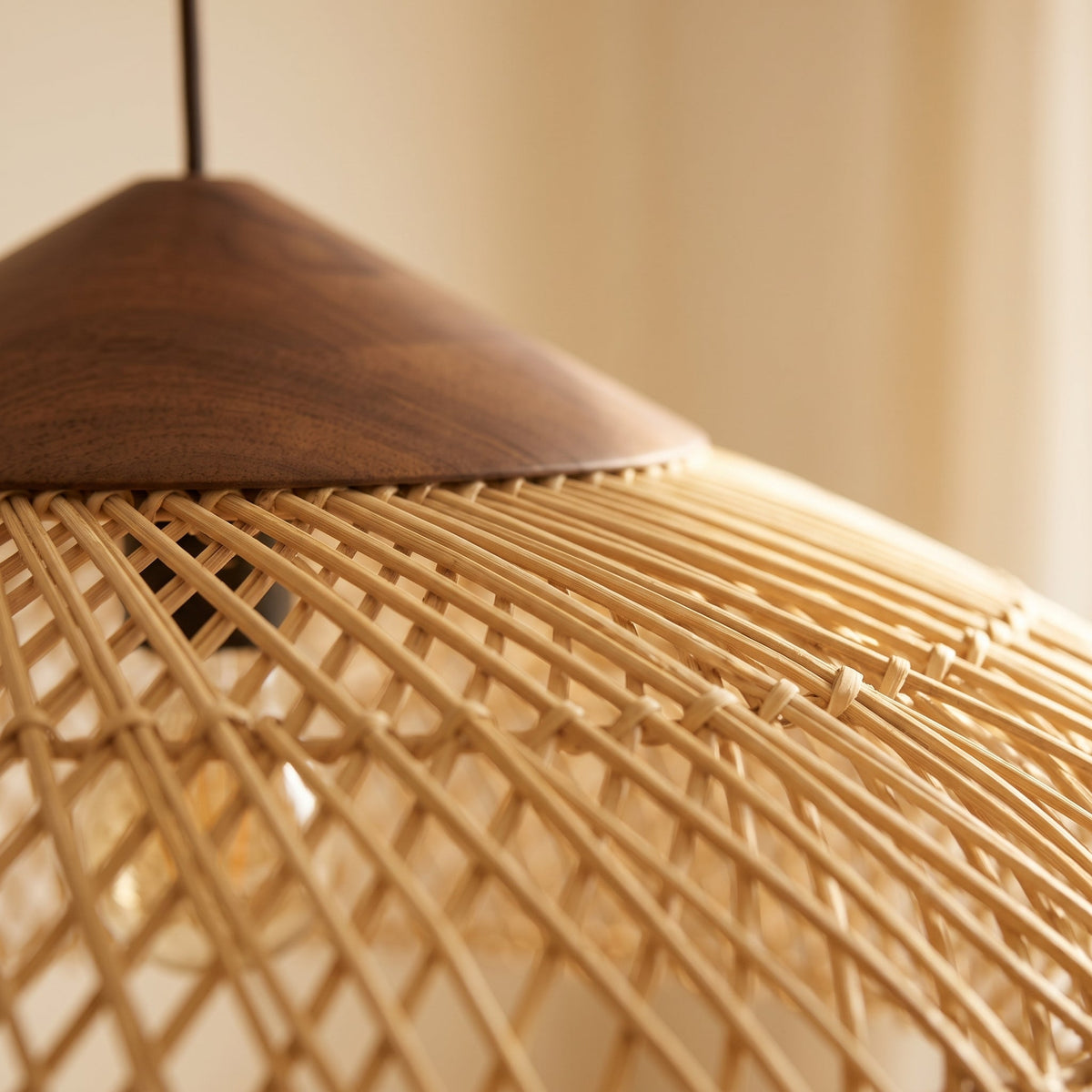Low flared rattan pendant light with natural wood cap – close-up detail