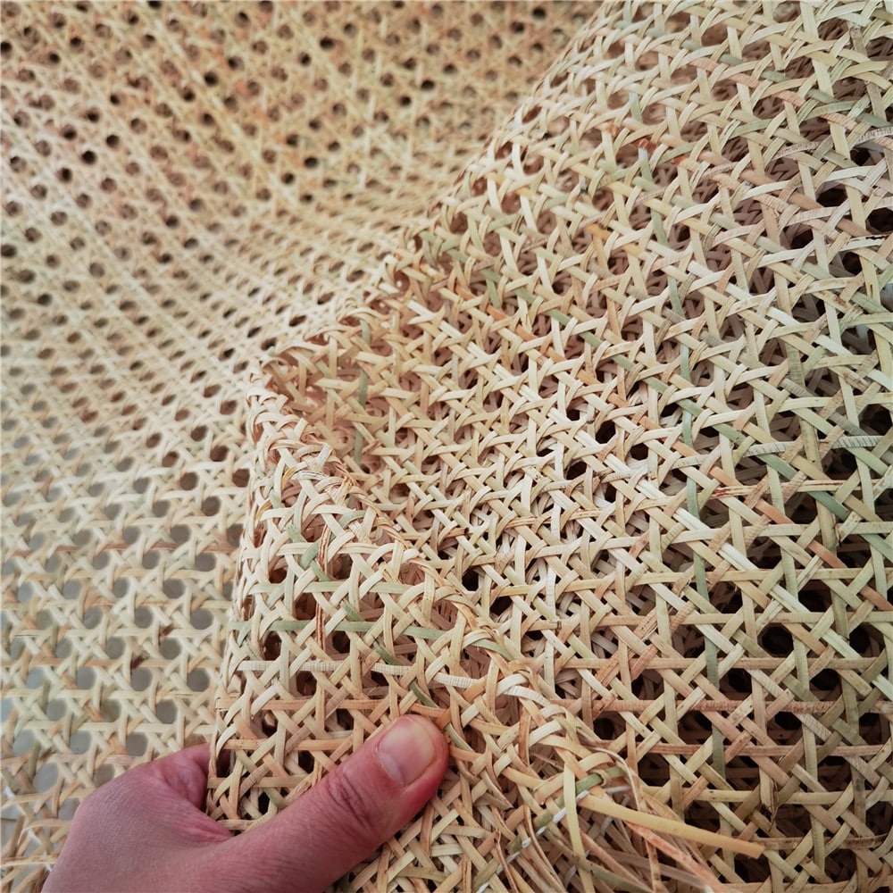 Green-tinted round mesh rattan cane webbing roll – shown in use