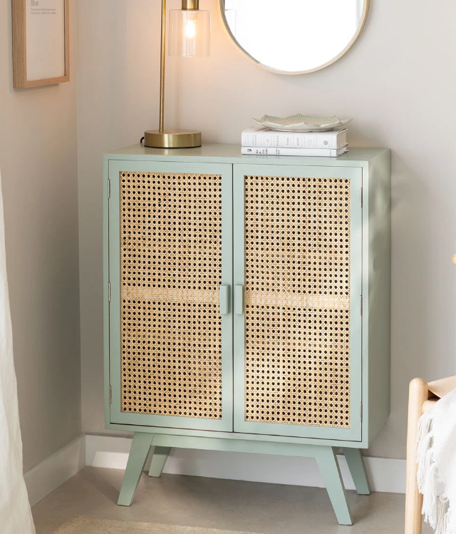 Golden round mesh rattan cane webbing roll – shown in a room setting
