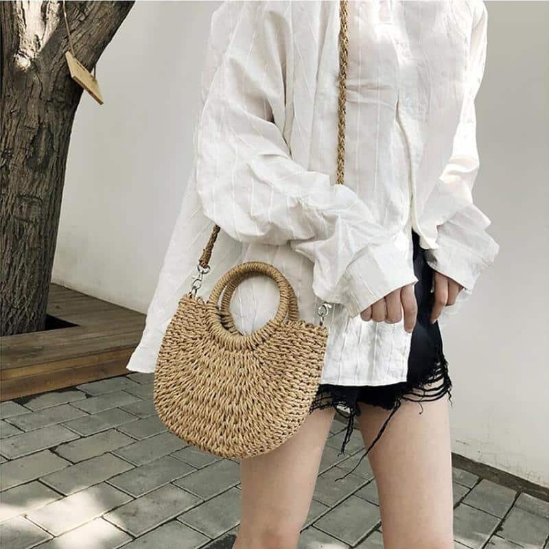 Half-moon woven rattan crossbody bag – worn by a model (3)
