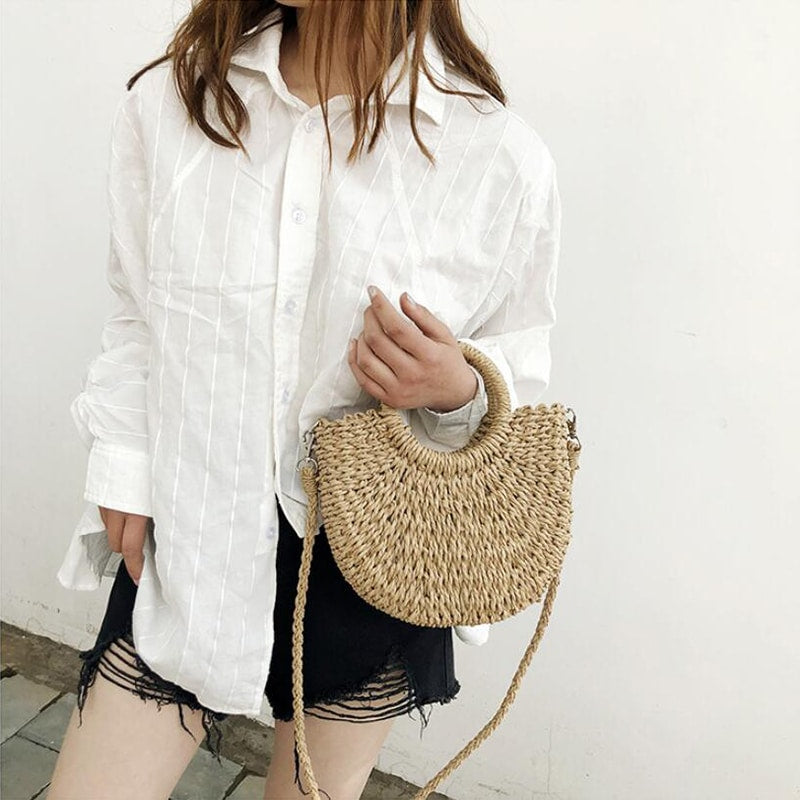 Half-moon woven rattan crossbody bag – worn by a model (2)