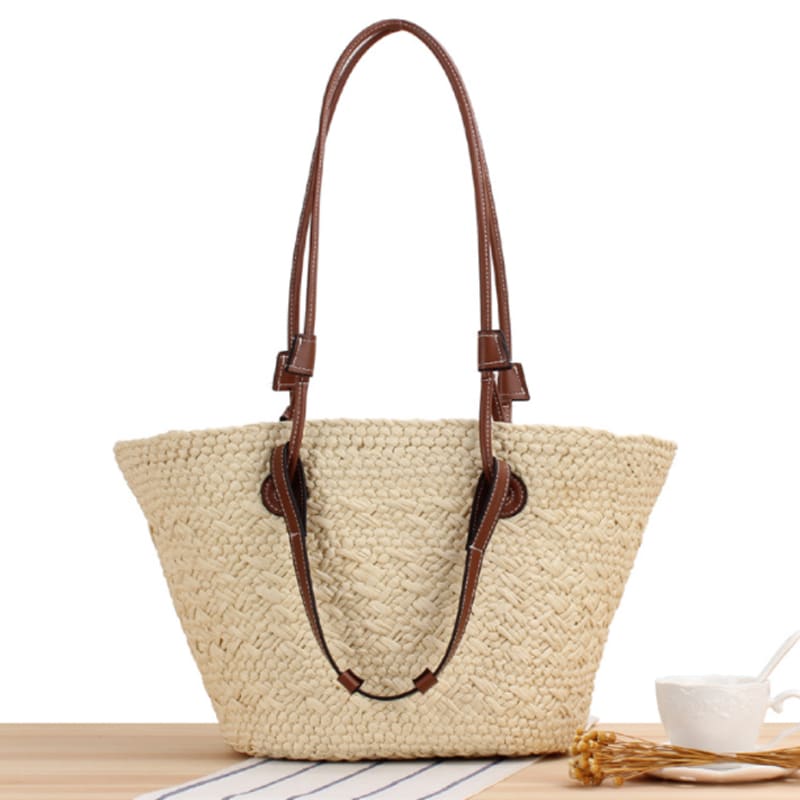 Handwoven straw handbag with two-tone brown handles