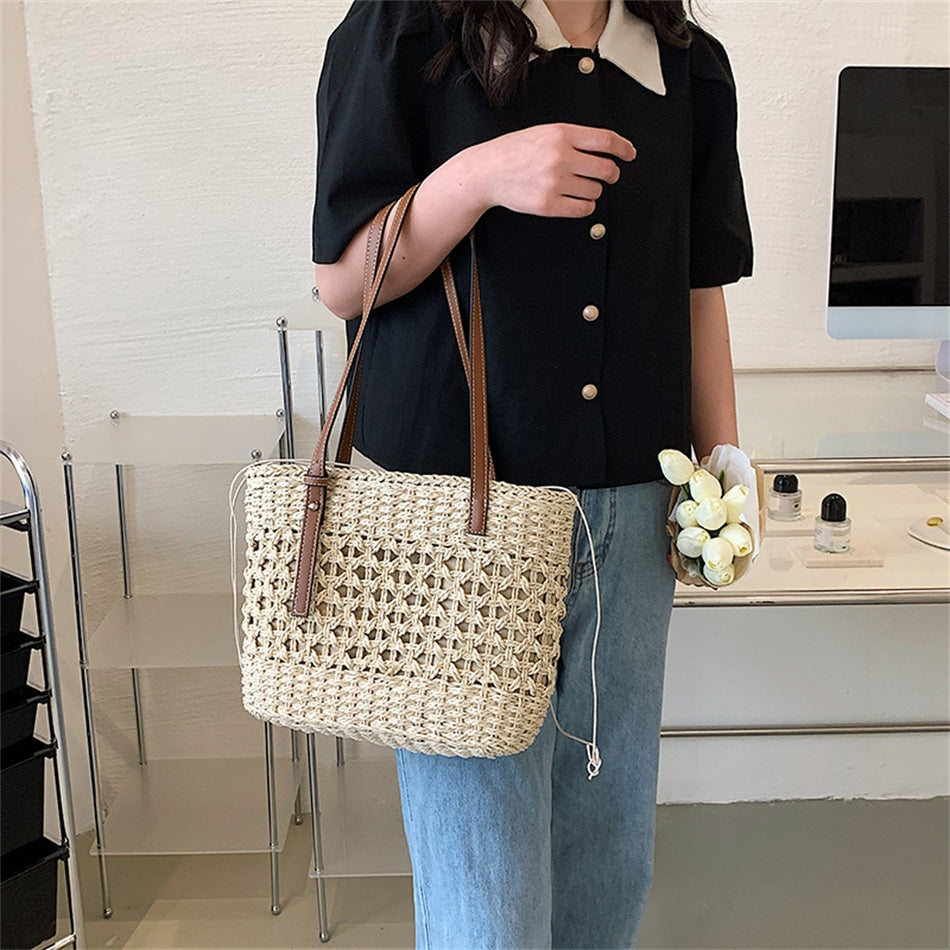 Beige golden straw beach handbag – worn by a model (3)