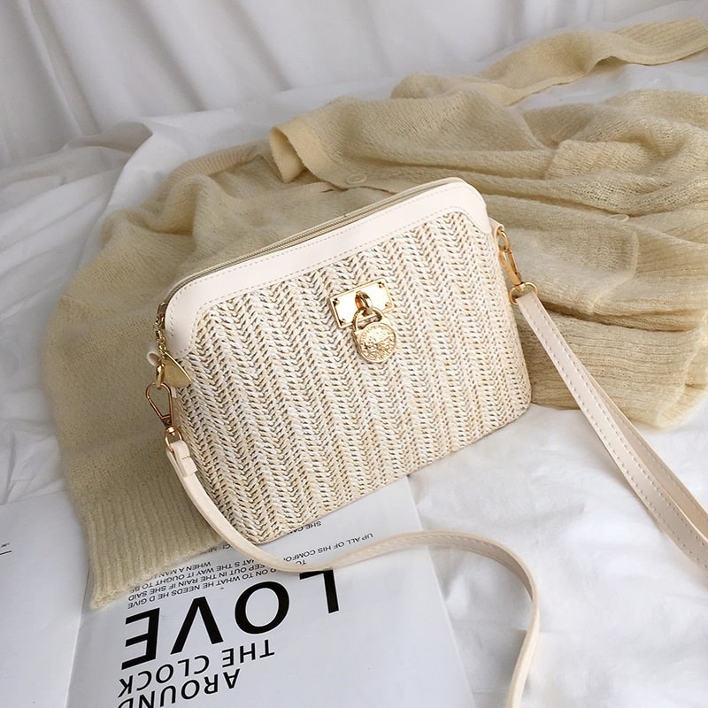 Beige rattan beach bag with gold chain handles