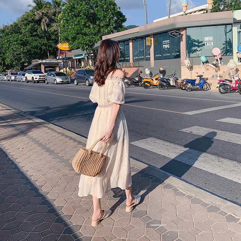 Structured handwoven rattan bag – worn by a model (2)