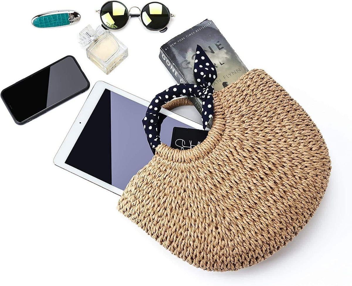 Rattan beach bag with a navy polka-dot scarf handle – close-up detail