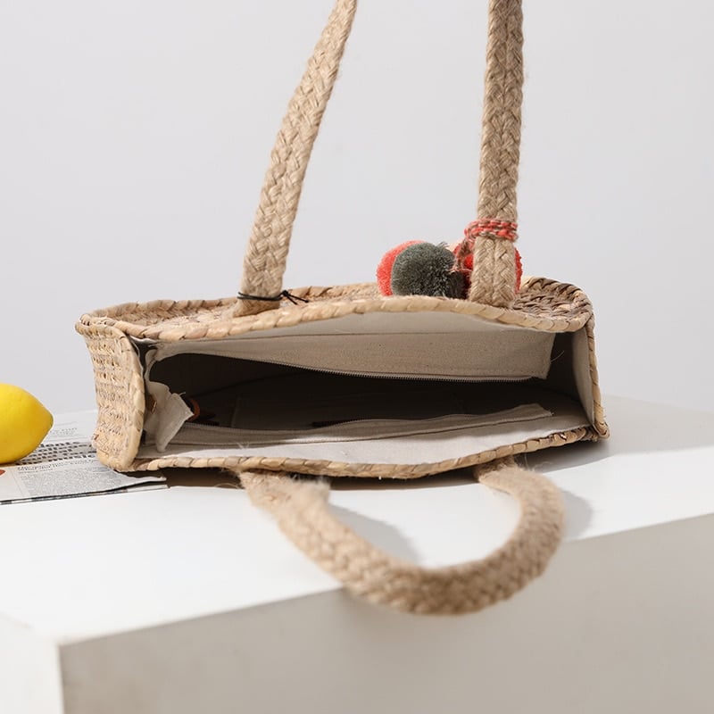 Round woven crossbody bag with a long strap – close-up detail