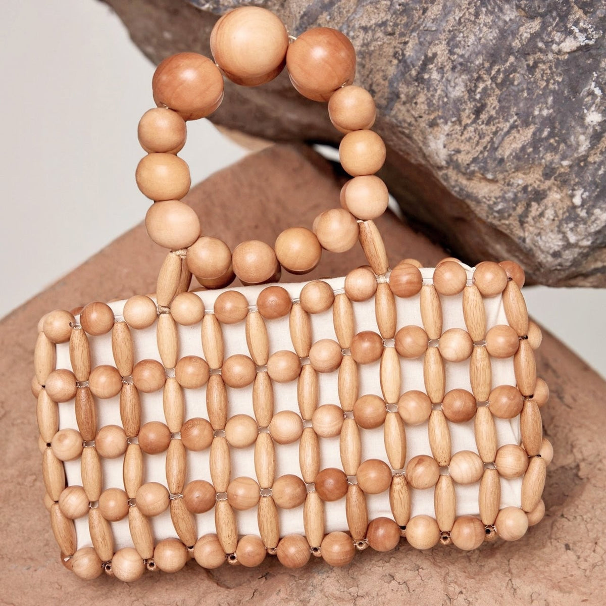 Retro woven handbag on a varnished wood frame – close-up detail