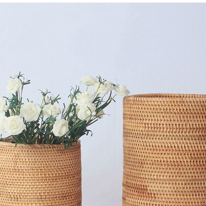 Cylindrical woven rattan storage bucket – shown in a room setting (2)