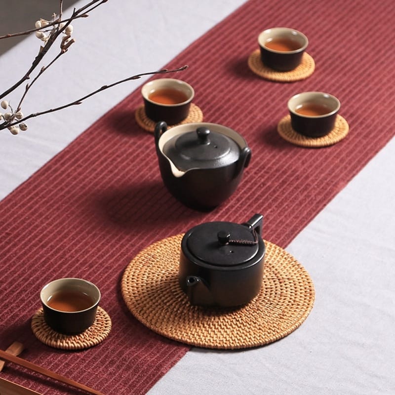 Set of six handwoven rattan drink coasters – shown in a room setting (3)