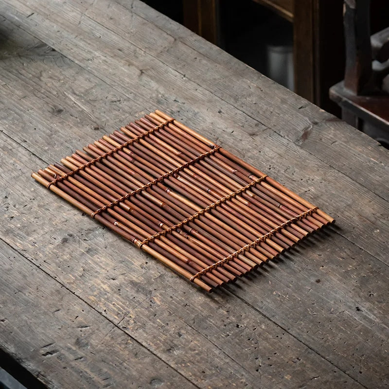 Modern golden bamboo placemat with rounded edges – shown in a room setting