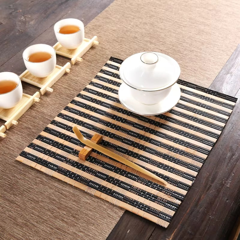 Rectangular beige and black bamboo placemat – shown in a room setting