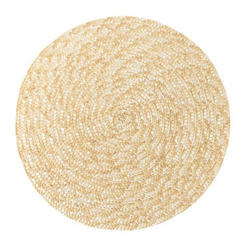 Round non-slip woven placemat in a sand color