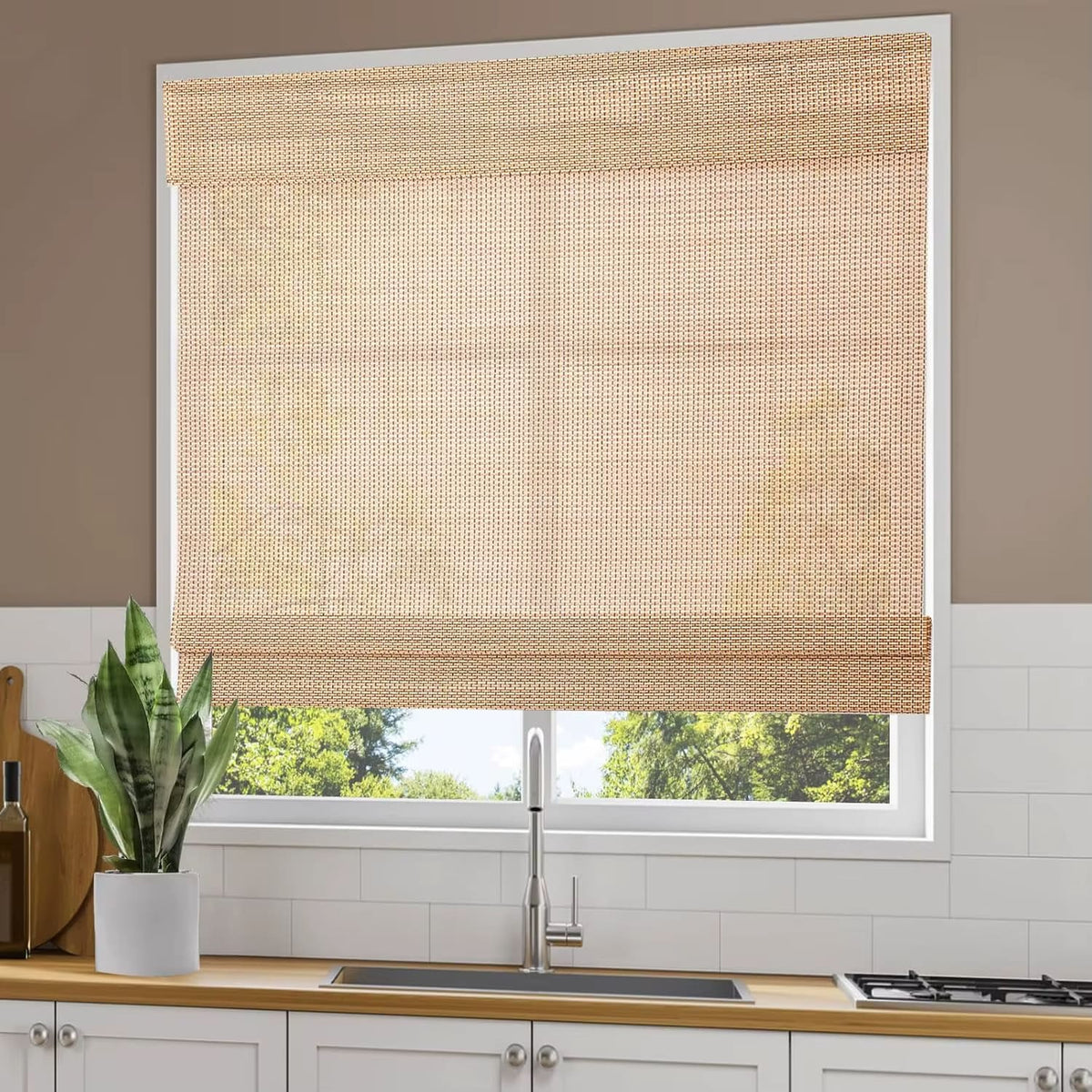 Hand-woven bamboo privacy blind with golden highlights – shown in a room setting