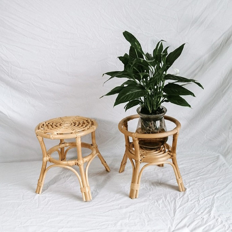 Compact natural rattan plant stand – shown in a room setting