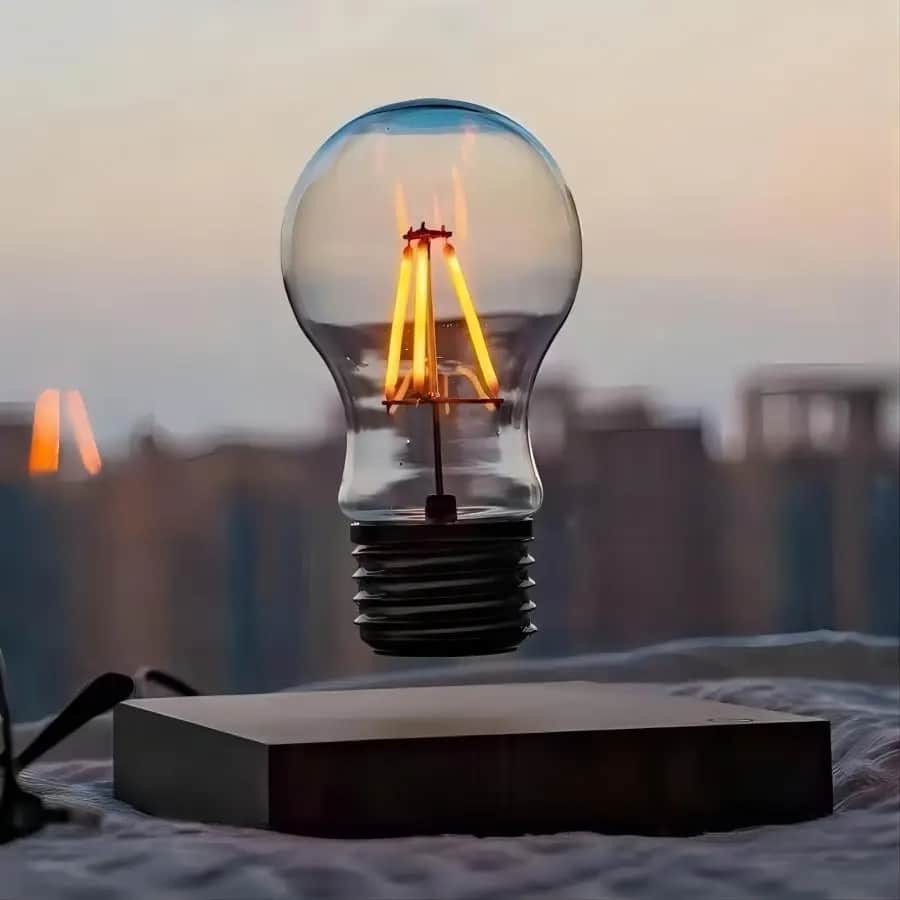 Levitating wood pendant light – shown lit in a room setting