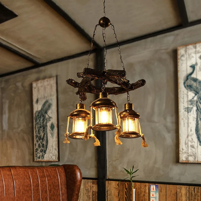 Industrial driftwood and iron pendant light – shown lit in a room setting