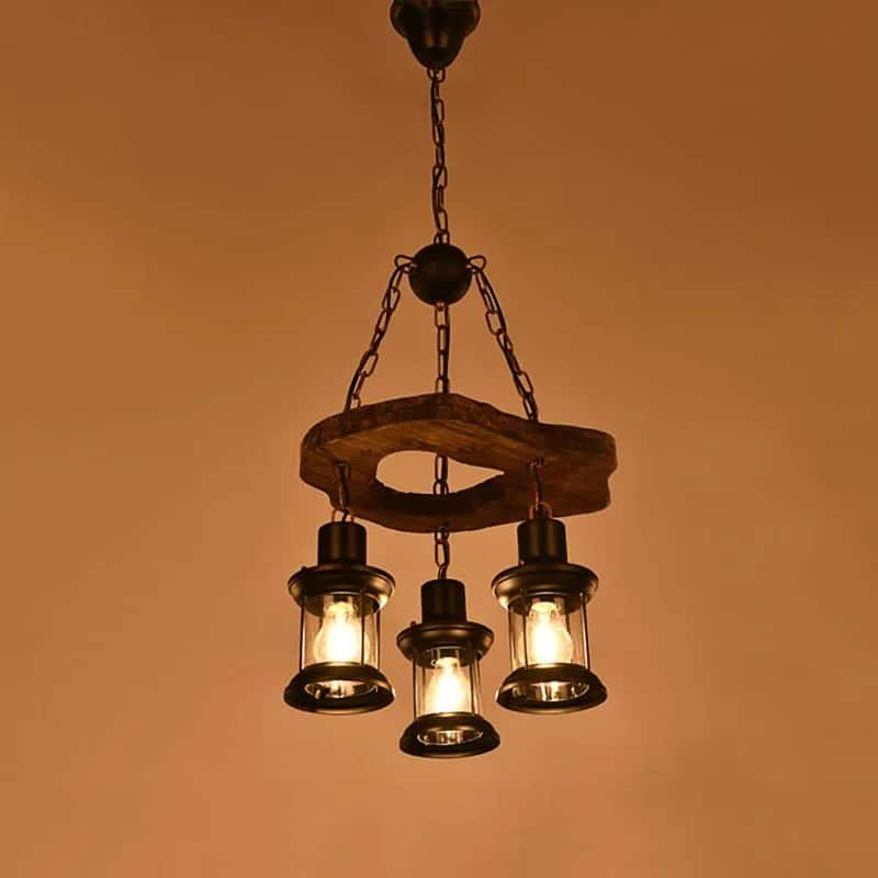 Driftwood branch chandelier with exposed filament bulbs – shown lit