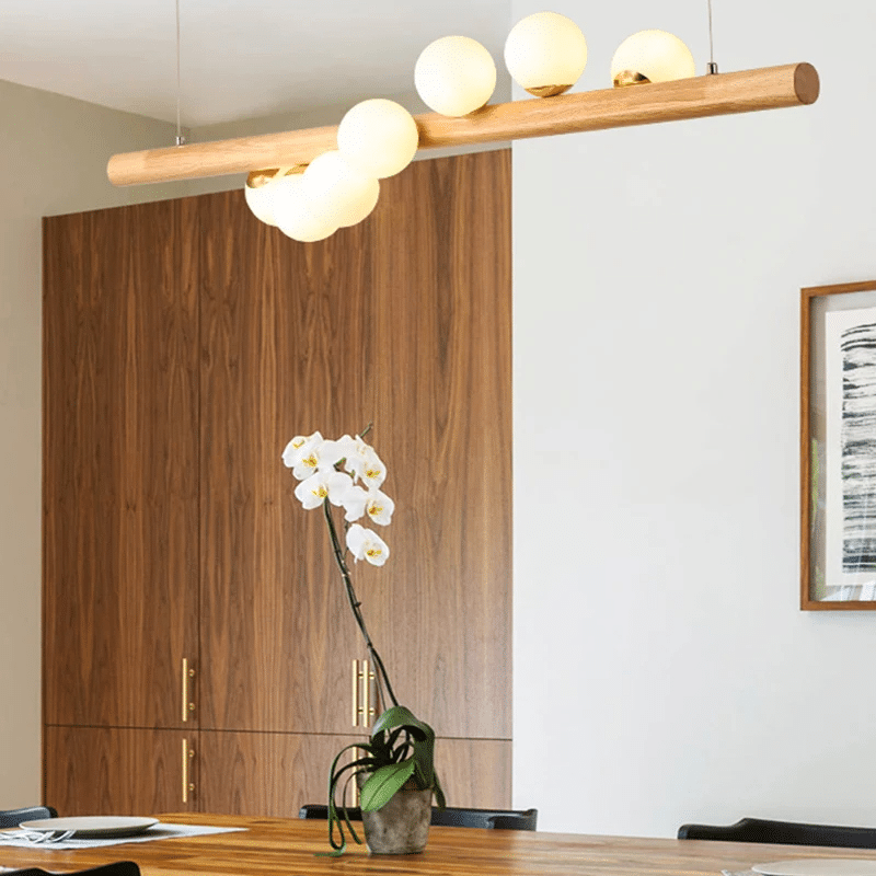 Wood and blown glass globe LED pendant light – shown in a room setting (2)