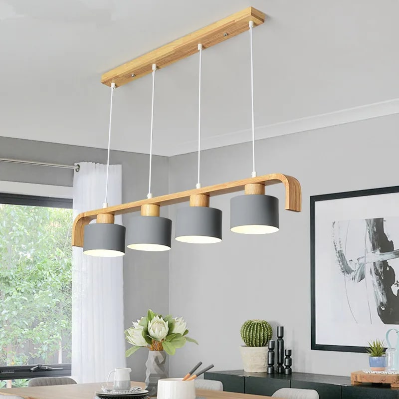 Hand-turned wood LED pendant light – gray variant, shown in a room setting