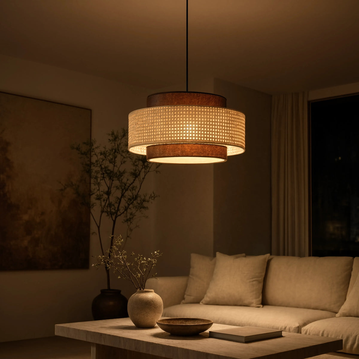 Otrante rattan cane drum pendant light – shown in a living room