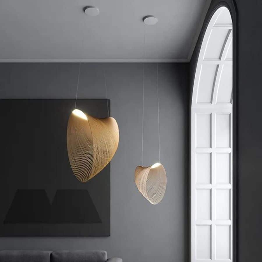 Futuristic geometric wood blade pendant light – shown in a room setting (2)