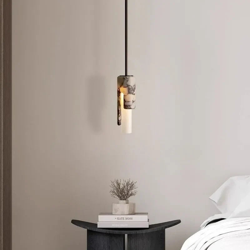 Syracuse marble column pendant light – shown in a bedroom