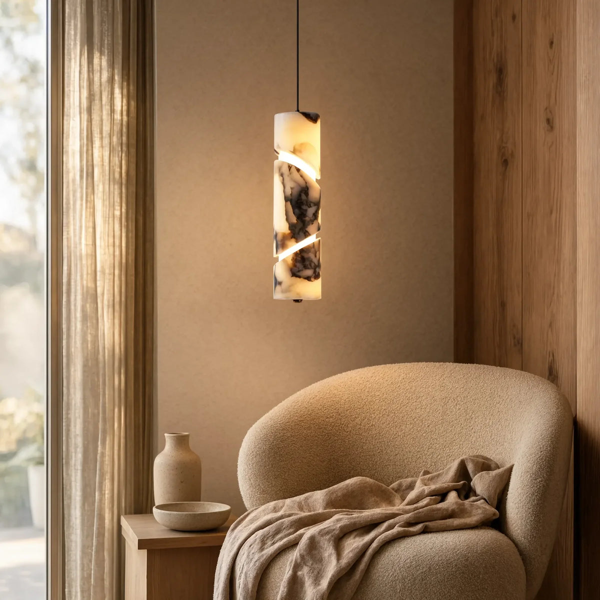 Solonte plum-veined marble cylinder pendant light – shown in a room setting