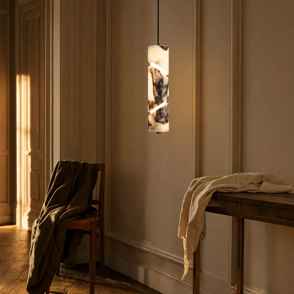 Solonte plum-veined marble cylinder pendant light – shown in an entryway