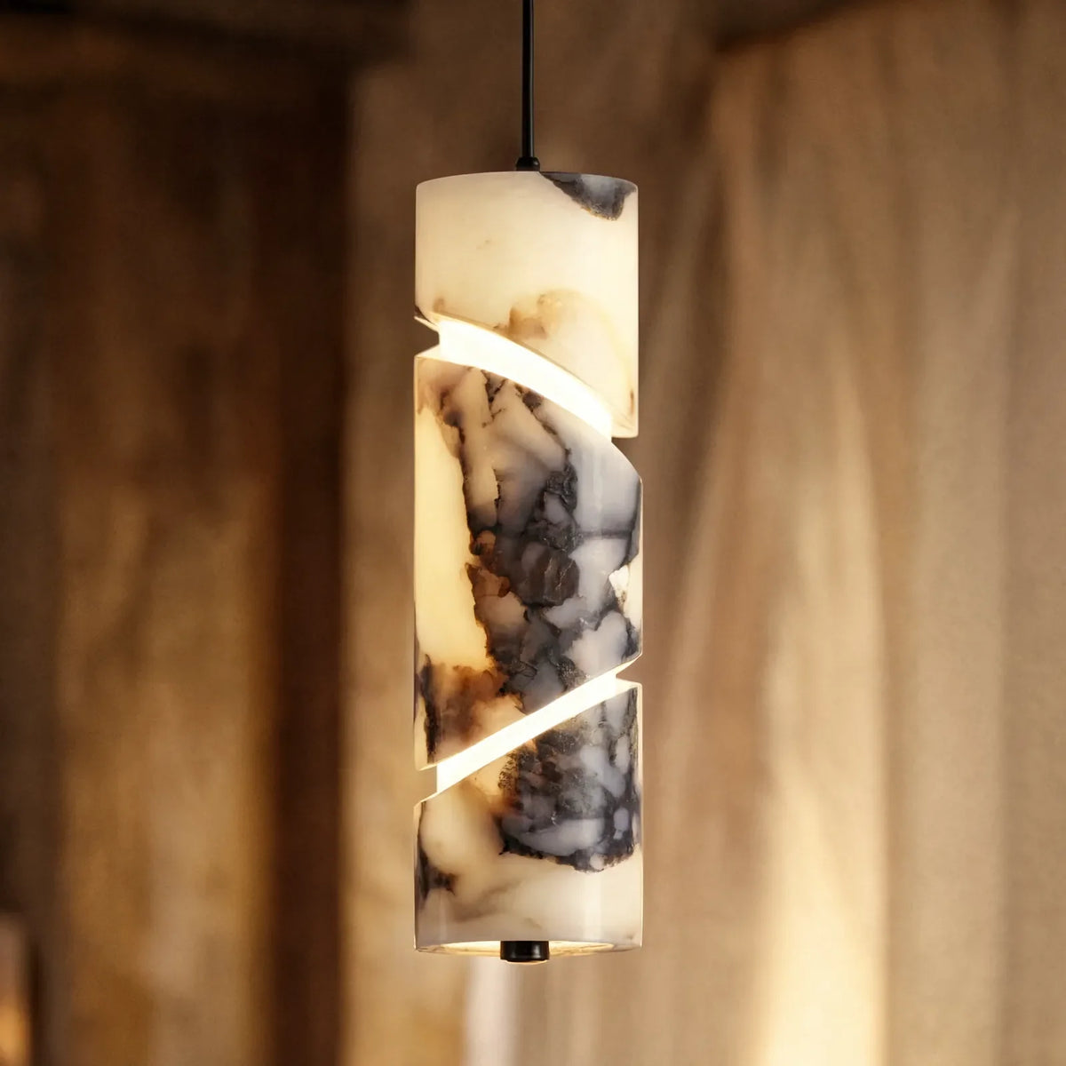Solonte plum-veined marble cylinder pendant light – close-up detail, lit