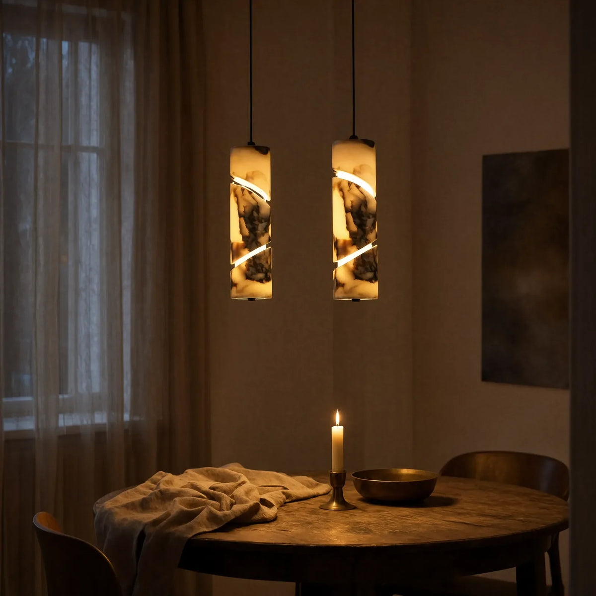 Solonte plum-veined marble cylinder pendant light – shown in a dining room