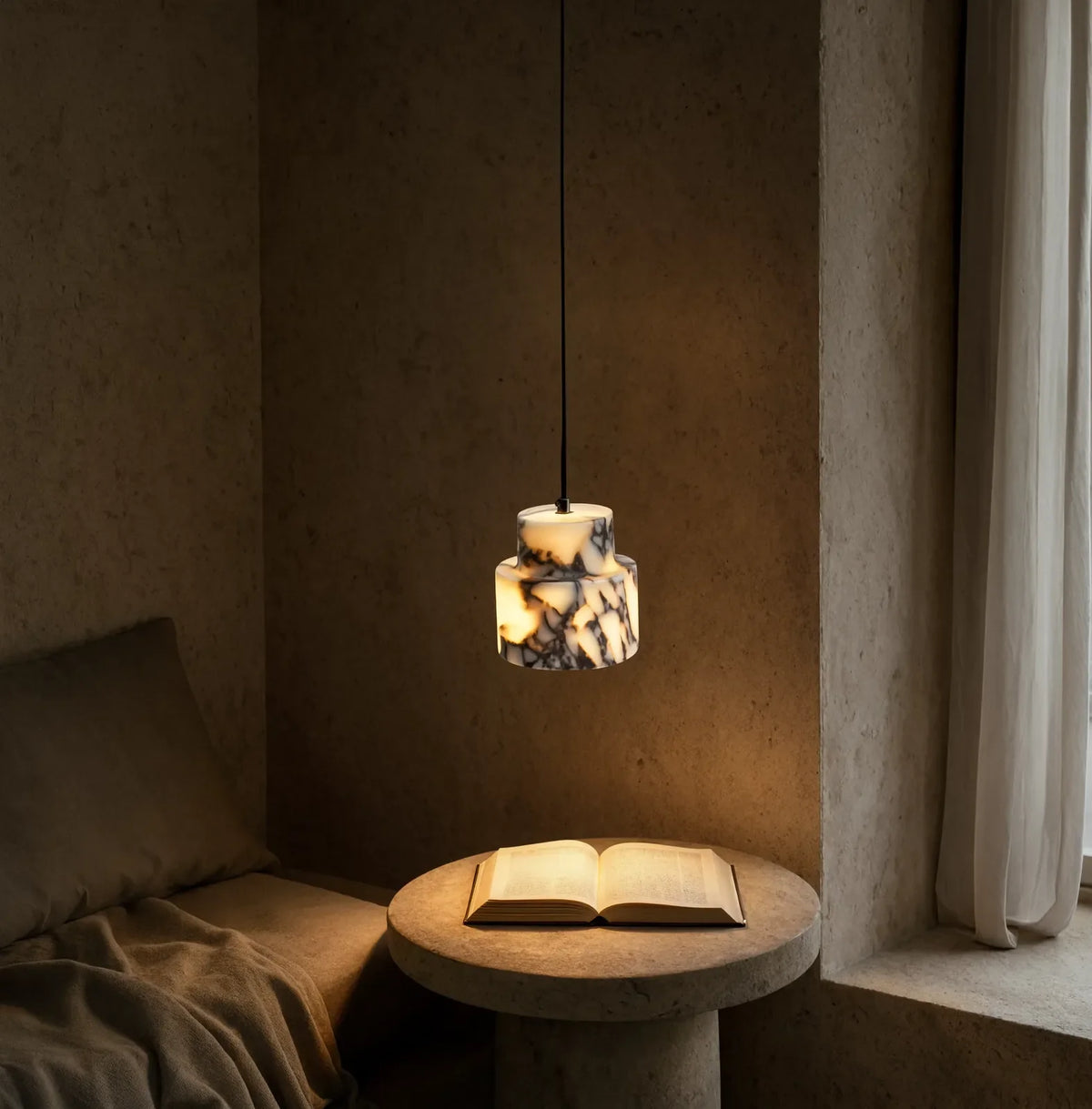 Héraclée two-tier white marble pendant light – shown in a room setting