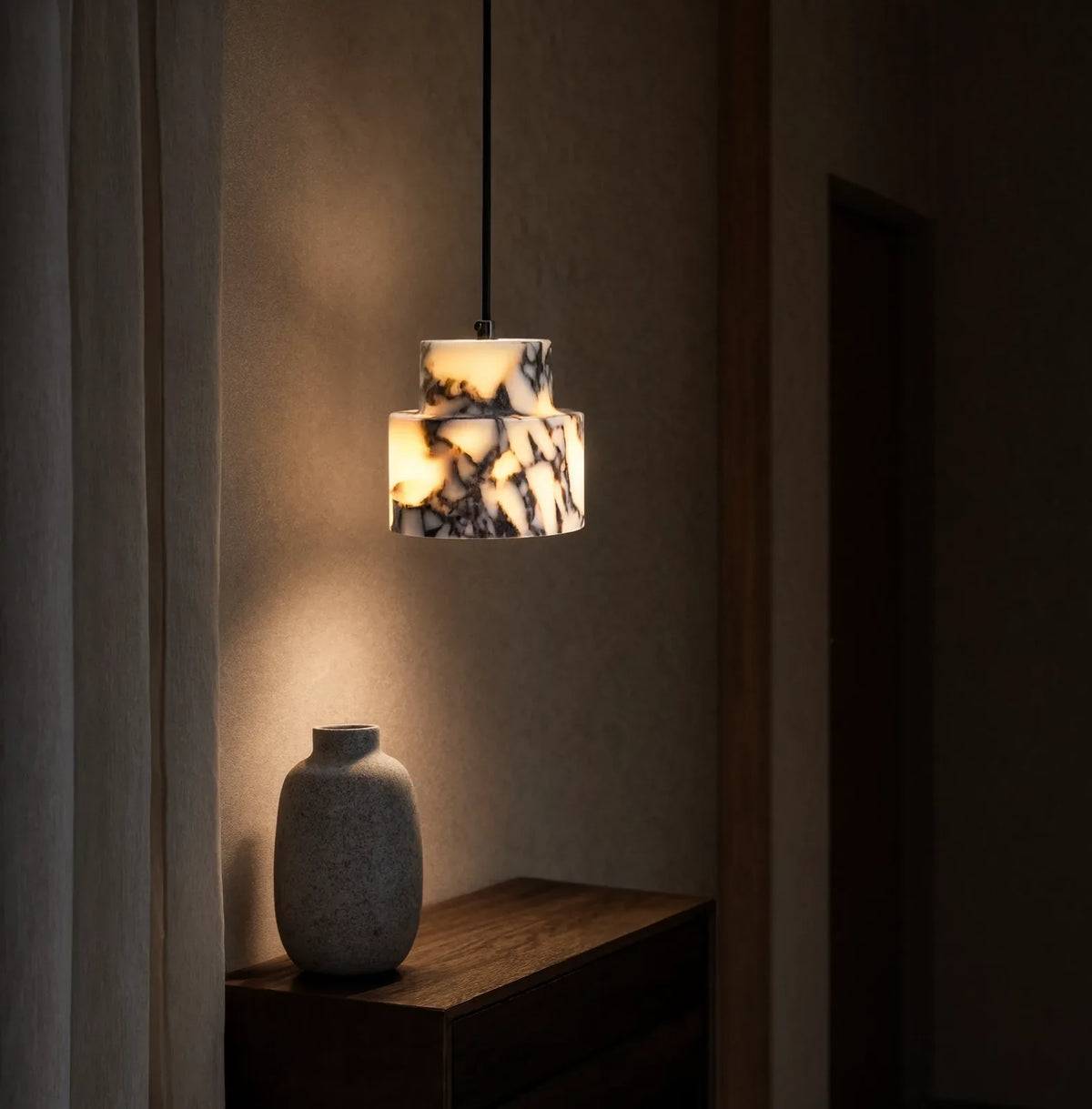 Héraclée two-tier white marble pendant light – shown in a room setting (3)