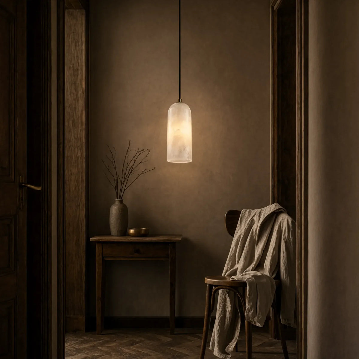 Tarente translucent marble pendant light with brushed brass canopy – shown in an entryway