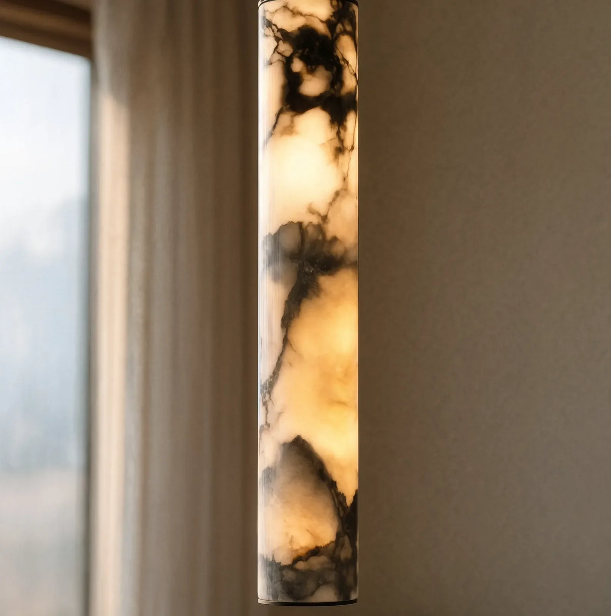 Sélinonte slim marble tube pendant light – close-up detail, lit