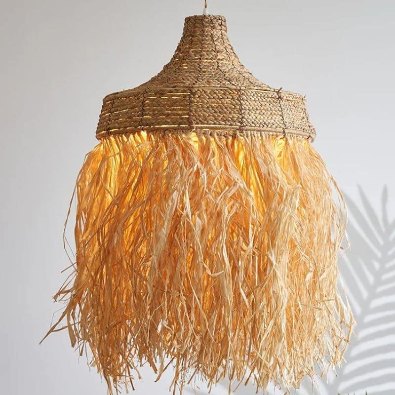 Handwoven textured straw pendant light with a rounded silhouette