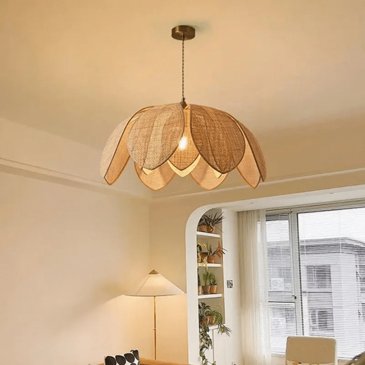 Chinese-style flared rattan petal LED pendant light on an iron frame – shown in a room setting (3)