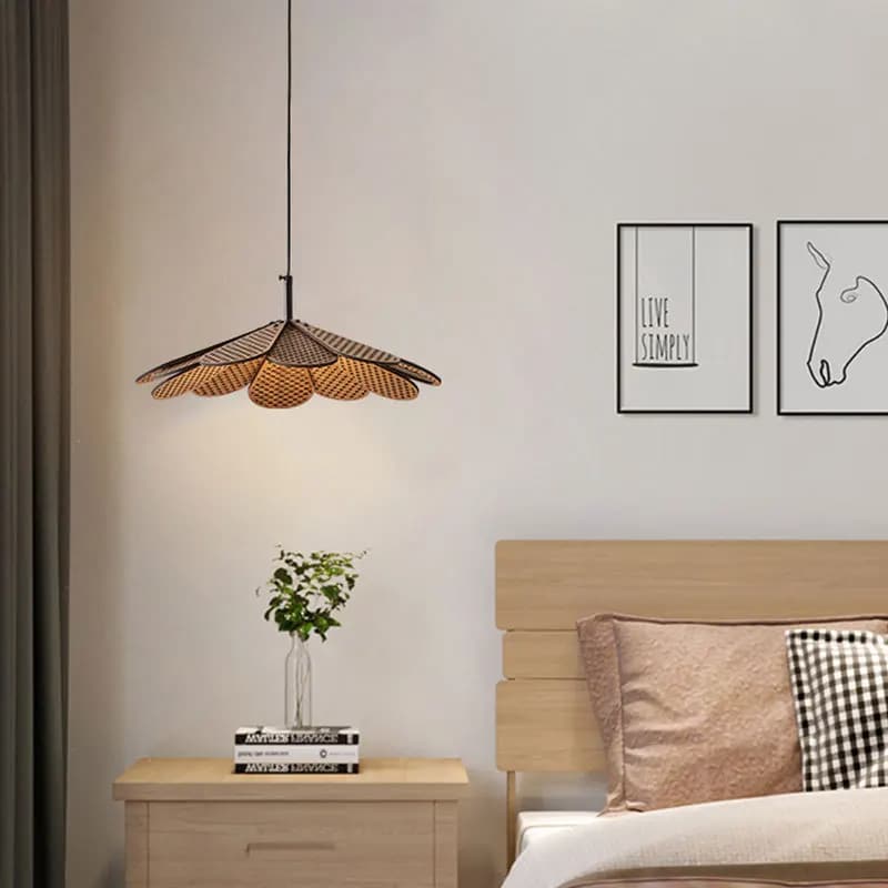 Korean-style light wood petal LED pendant light around a metal ring – shown in a room setting