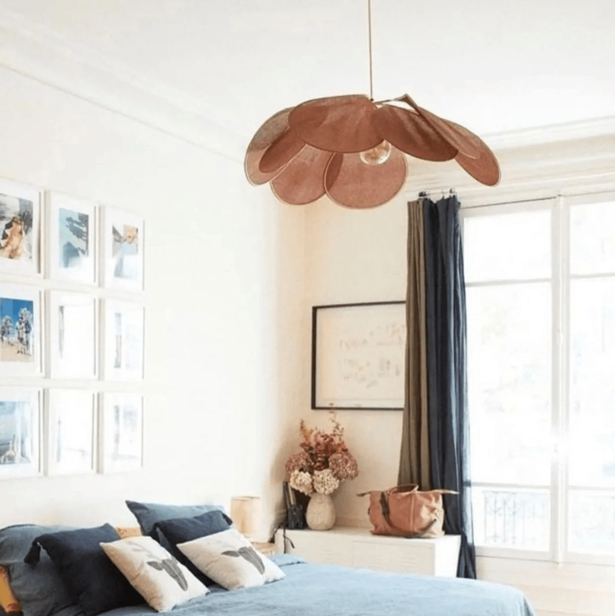 Rattan-look fabric petal pendant light with wide flared petals – shown in a room setting