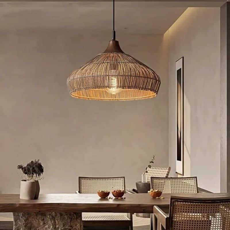 Adjustable-height handwoven rattan pendant light with open mesh – shown in a room setting (2)