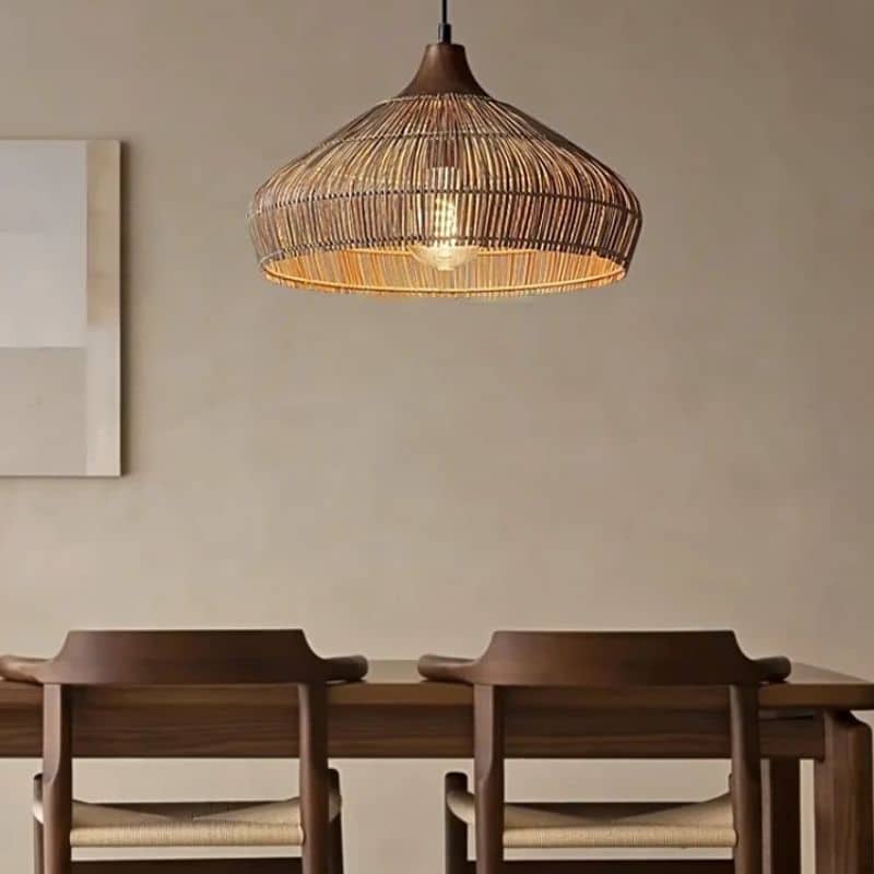 Adjustable-height handwoven rattan pendant light with open mesh – shown in a room setting (3)