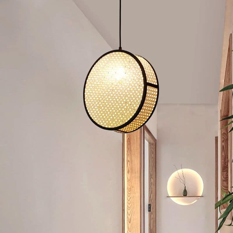 Modern openwork geometric rattan pendant light – shown in a room setting (3)