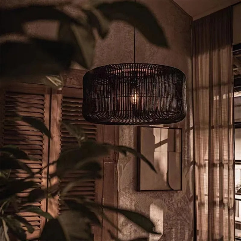Flared handwoven rattan slat dome pendant light – black variant, shown in a room setting