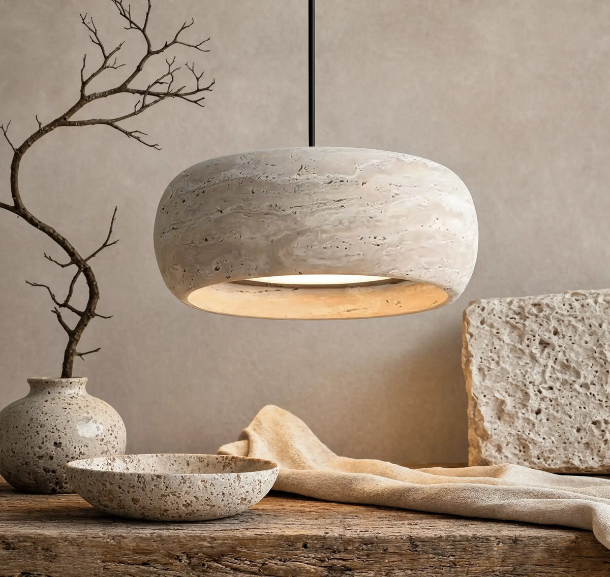 Claros travertine ring pendant light – shown in a room setting